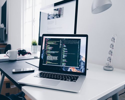 A clean home office setup with ergonomic chair and good screen distance